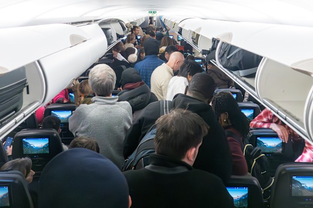 An airline has called out passengers who stand as soon as the seatbelt sign is off.