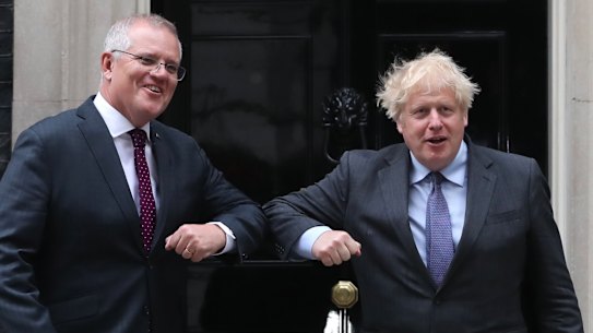 Giving the FTA a nudge ... prime ministers Scott Morrison and Boris Johnson outside Downing Street.