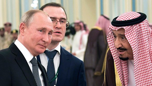 Russian President Vladimir Putin, left, and Saudi Arabia's King Salman talk during their meeting in Riyadh, Saudi Arabia.