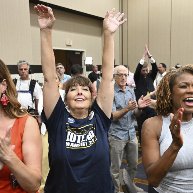 People applaud during a primary watch party in Overland Park, Kansas. State voters rejected a ballot measure  in the conservative state with deep ties to the anti-abortion movement.