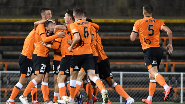 The Roar celebrates after Stefan Mauk's goal against Sydney FC.