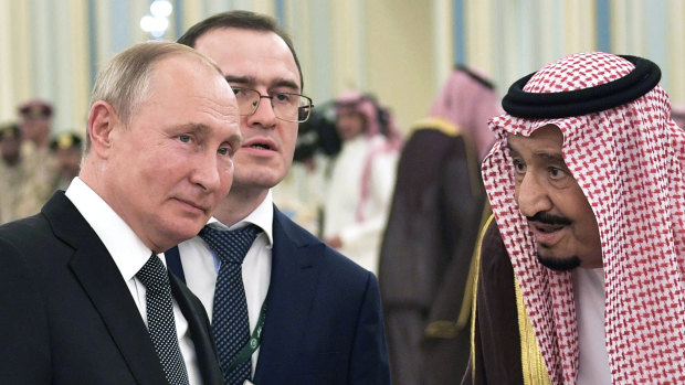 Russian President Vladimir Putin, left, and Saudi Arabia's King Salman talk during their meeting in Riyadh, Saudi Arabia.