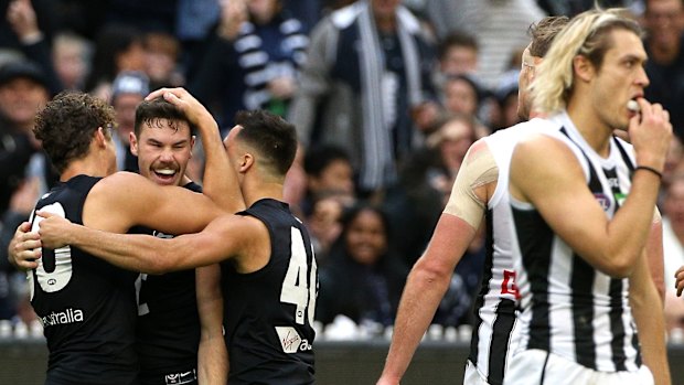 Happy moment: Carlton's Mitch McGovern celebrates a goal with teammates.