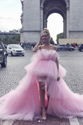 Italian fashionista Chiara Ferragni in her mullet dress in front of the Arc de Triomphe in Paris.