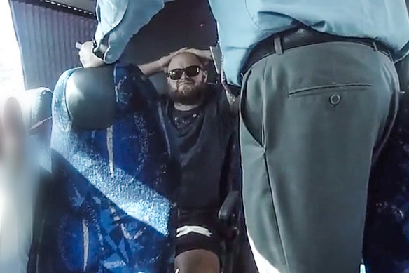 Kevin James Pettiford, who referred to himself as the Hand of Death, is arrested on a bus as it stops in Tweed Heads on November 26, 2019.