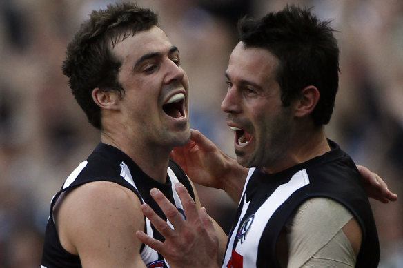 Sidebottom celebrates an Alan Didak goal in the 2010 grand final replay.