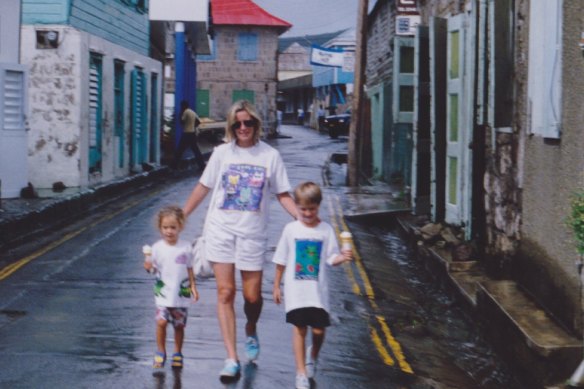 Australian film producer Cody Greenwood, left, as a child with her mother Frane Lessac and brother Luke on Montserrat in 1993.
