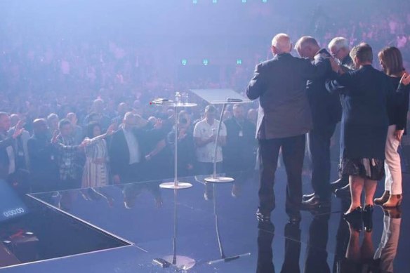 Prime Minister Scott Morrison receives a blessing at the Australian Christian Churches conference.