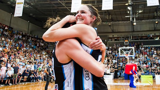 Canberra Capitals celebrate after winning the grand final.