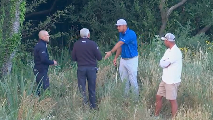 Bryson DeChambeau speaking with officials after his second round at Royal Birkdale
