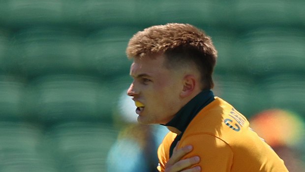 Australia’s William Cartwright leaves the field after being injured in the match against New Zealand.