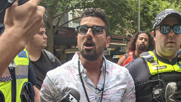 Avi Yemini, pictured at an Invasion Day rally in 2020, wants to find out who is behind the @PRGuy17 Twitter account so that he can pursue defamation against them.
