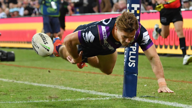 Air time: Ryan Papenhuyzen dives to score during the Storm's hammering of the Eels in Brisbane.