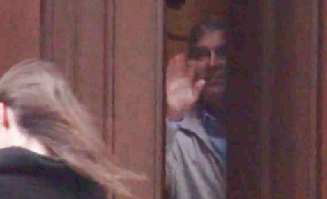 Prince Andrew, inside the mansion of convicted paedophile Jeffrey Epstein, appears to wave goodbye to a woman.
