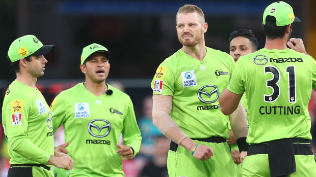 Nathan McAndrew celebrates dismissing Aaron Finch of the Renegades on New Year's Day.