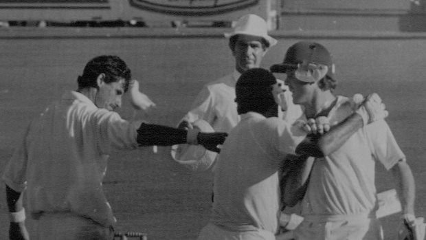 Craig McDermott and Mike Whitney celebrate the 1987 draw with New Zealand as Richard Hadlee offers his congratulations.