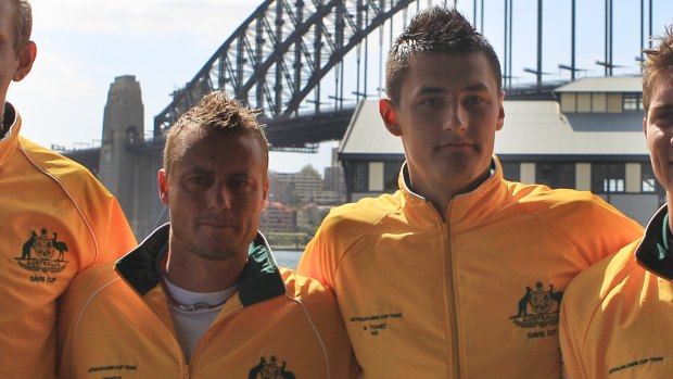 Tomic and Hewitt in happier times during a Davis Cup draw in 2011. 