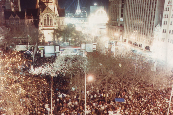 Crowds wait for the announcement on who will host the 1996 Games in City Square, Melbourne.