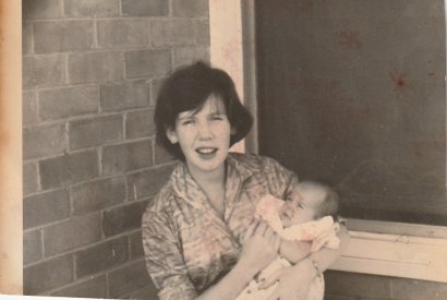 Deirdre O’Connor aged 22, with baby David in Woomera, South Australia, 1963.