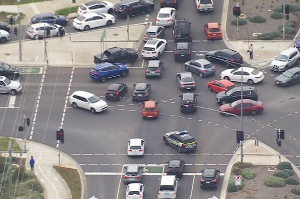 Cars even queued across intersections. 