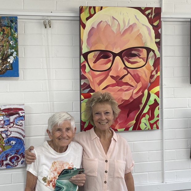 Brisbane-based artist Anne Collins, 99, with friend Kathy Sullivan in Art Space Toowong.