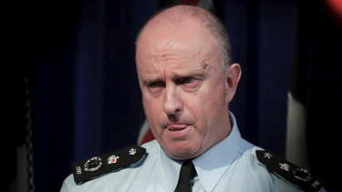 Acting Australian Federal Police commissioner Neil Gaughan fields questions over the raids. 