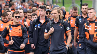 Giants players descend on the MCG.