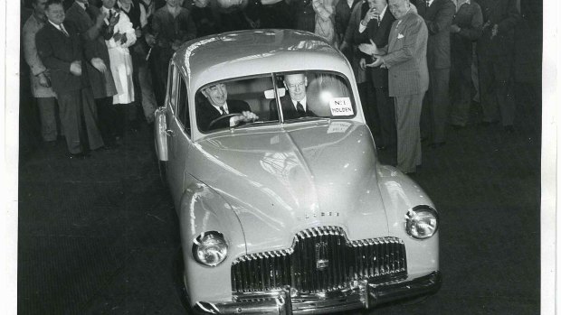 Mr. Harold Bettle, then Managing Director of GMH, drives the first production Holden off the assembly line in Fishermans Bend.