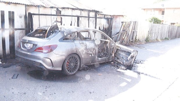 A silver Mercedes, used as a getaway car, was set on fire.