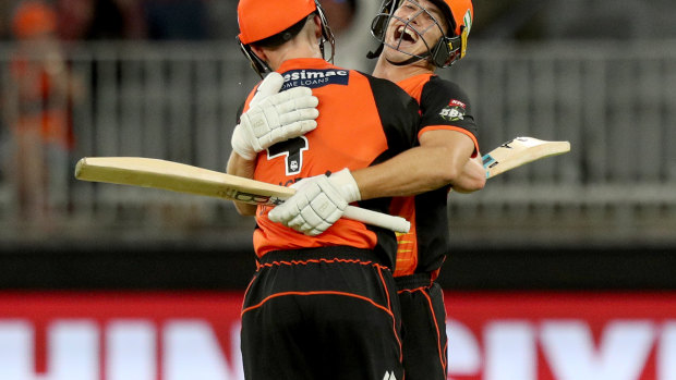 Cameron Bancroft (left) celebrates with Scorchers teammate Hilton Cartwright after beating the Sydney Sixers at Optus Stadium in Perth on Sunday night.
