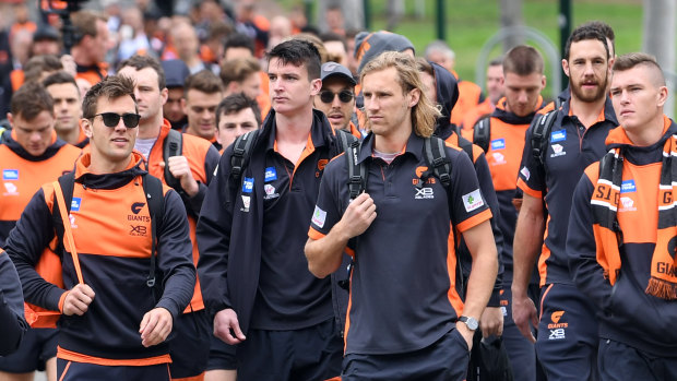 Giants players descend on the MCG.