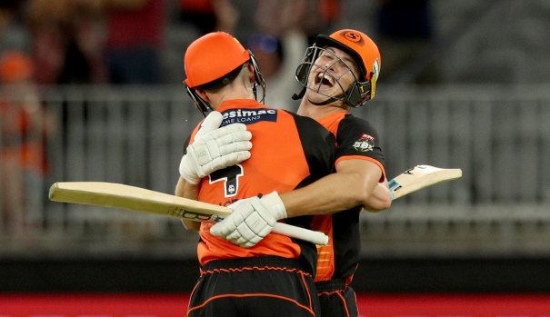 Cameron Bancroft (left) celebrates with Scorchers teammate Hilton Cartwright after beating the Sydney Sixers at Optus Stadium in Perth on Sunday night.