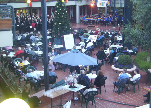 Carols by Queerlight in 2002 at Prahran Market courtyard, with Melbourne Rainbow Band and when Melbourne Gay and Lesbian Chorus sang at the event.