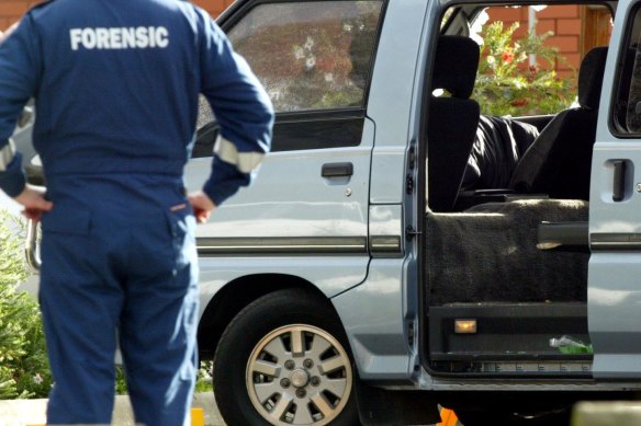 Police examine the van in which Jason Moran and Pasquale Barbaro were murdered.