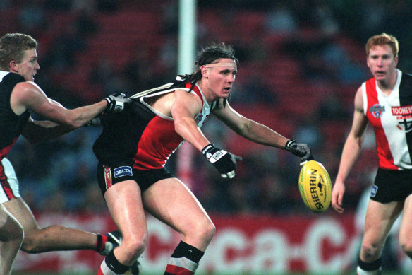 Dustin Fletcher tackles Peter Everitt earlier in the game. 