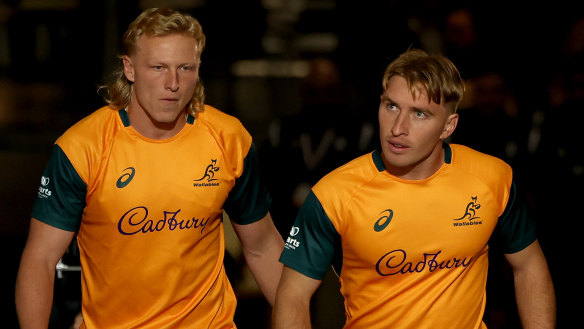 Carter Gordon and Tate McDermott walk onto the MCG.