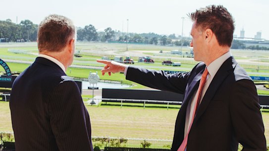 Premier Chris Minns, with Australian Turf Club chair Peter McGauran, at Rosehill Racecourse in December last year.