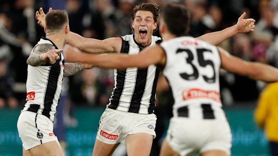Patrick Lipinski at teammates celebrate after the Magpies’ thrilling win.