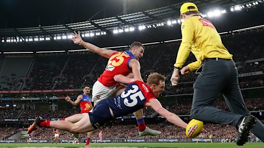Harrison Petty dives to get a hand on a goal-bound kick from Daniel McStay.
