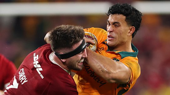 Joseph-Aukuso Suaalii of the Wallabies is tackled by Tom Curry.