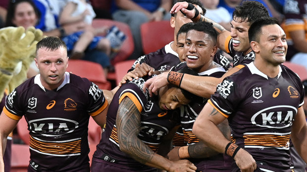 The Broncos mob try-scorer Jamayne Isaako, one of the few bright lights in an insipid match.