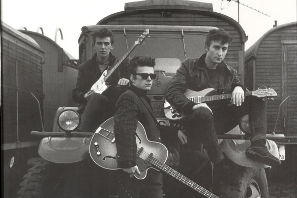 George Harrison, Stuart Sutcliffe, and John Lennon of the Beatles pose for a portrait in Liverpool in this 1959 photo. 