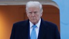 Donald Trump leaves Air Force One on his way back to the White House to confront a panic week on Wall Street
