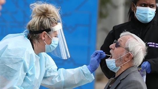A man is tested at a pop-up testing site in Dallas.
