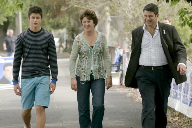 Nick Bracks with his parents in 2006.