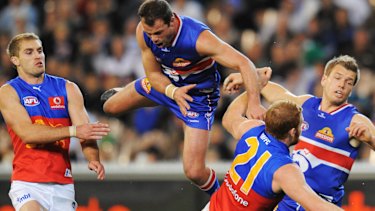 Brad Johnson crashes into Daniel Merrett.