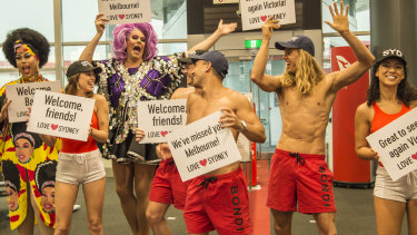 Lifeguards and drag queens greeted the flights from Victoria on Monday as the Victorian-NSW border reopened.