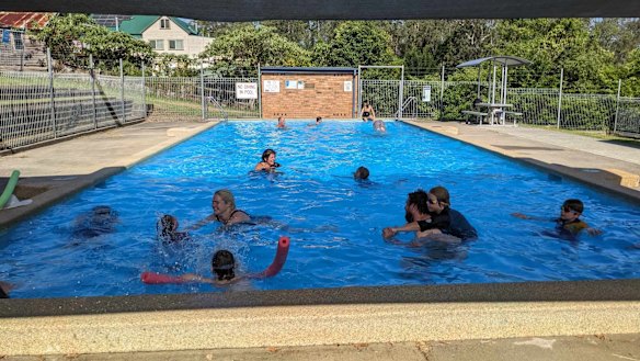 Families enjoy a swim at Krambach public pool.