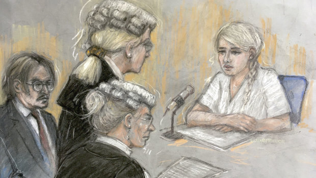 In this court artist sketch by Elizabeth Cook, actress Amber Heard being being cross-examined by Eleanor Laws as she gives evidence at the High Court in London.
