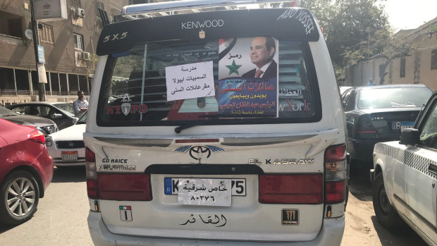 Van adorned with Sisi posters transporting voters in what is widely seen as vote buying.
